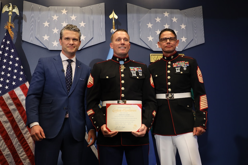 U.S. Marine Corps Sgt. Dakota Meyer, a Medal of Honor recipient, stands with Pete Hegseth, the Secretary of Defense, and Sgt. Maj. Carlos Ruiz, the Sergeant Major of the Marine Corps, after reenlisting in a ceremony at the Pentagon, April 17, 2025. Sgt. Meyer is the only living Medal of Honor recipient currently serving in the Marine Corps. (U.S. Marine Corps photos by Lance Cpl. Abigail Hutcheson)