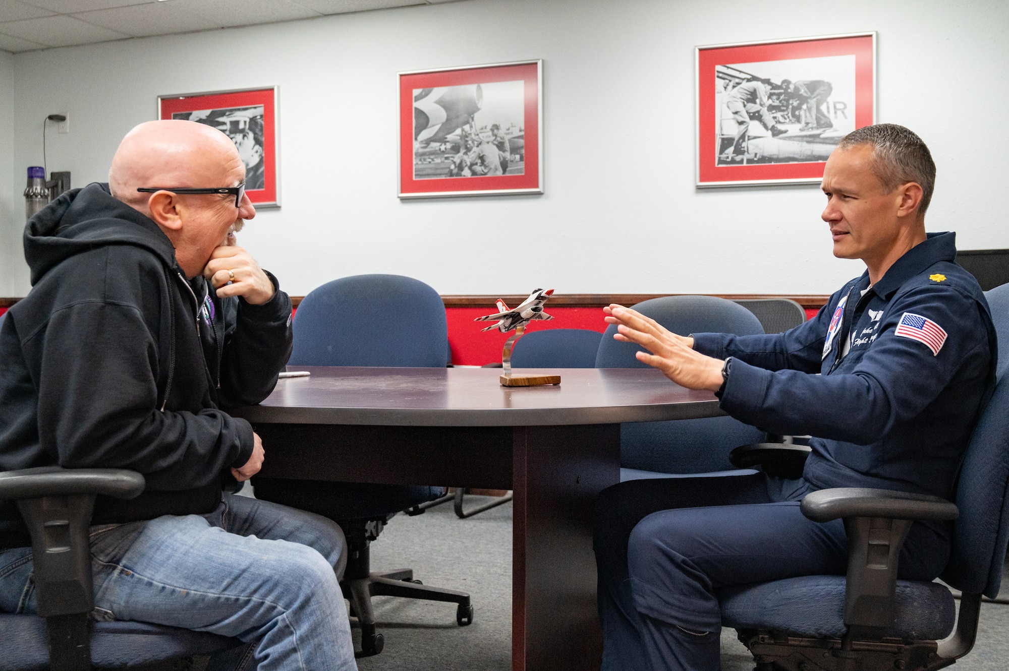 Michael Patterson, left, Hometown Hero participant, receives a briefing from U.S. Air Force Maj. Jacob Hall, a flight surgeon assigned to the Thunderbirds, on breathing techniques and the effects of G-forces on April 4, 2025 at Nellis Air Force Base, Nevada.