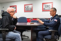 Michael Patterson, left, Hometown Hero participant, receives a briefing from U.S. Air Force Maj. Jacob Hall, a flight surgeon assigned to the Thunderbirds, on breathing techniques and the effects of G-forces on April 4, 2025 at Nellis Air Force Base, Nevada.
