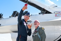 U.S. Air Force Lt. Col. Taylor Wight, right, an operations officer assigned to the Thunderbirds, takes a picture with Hometown Hero participant, Michael Patterson, on April 4, 2025 at Nellis Air Force Base, Nevada.