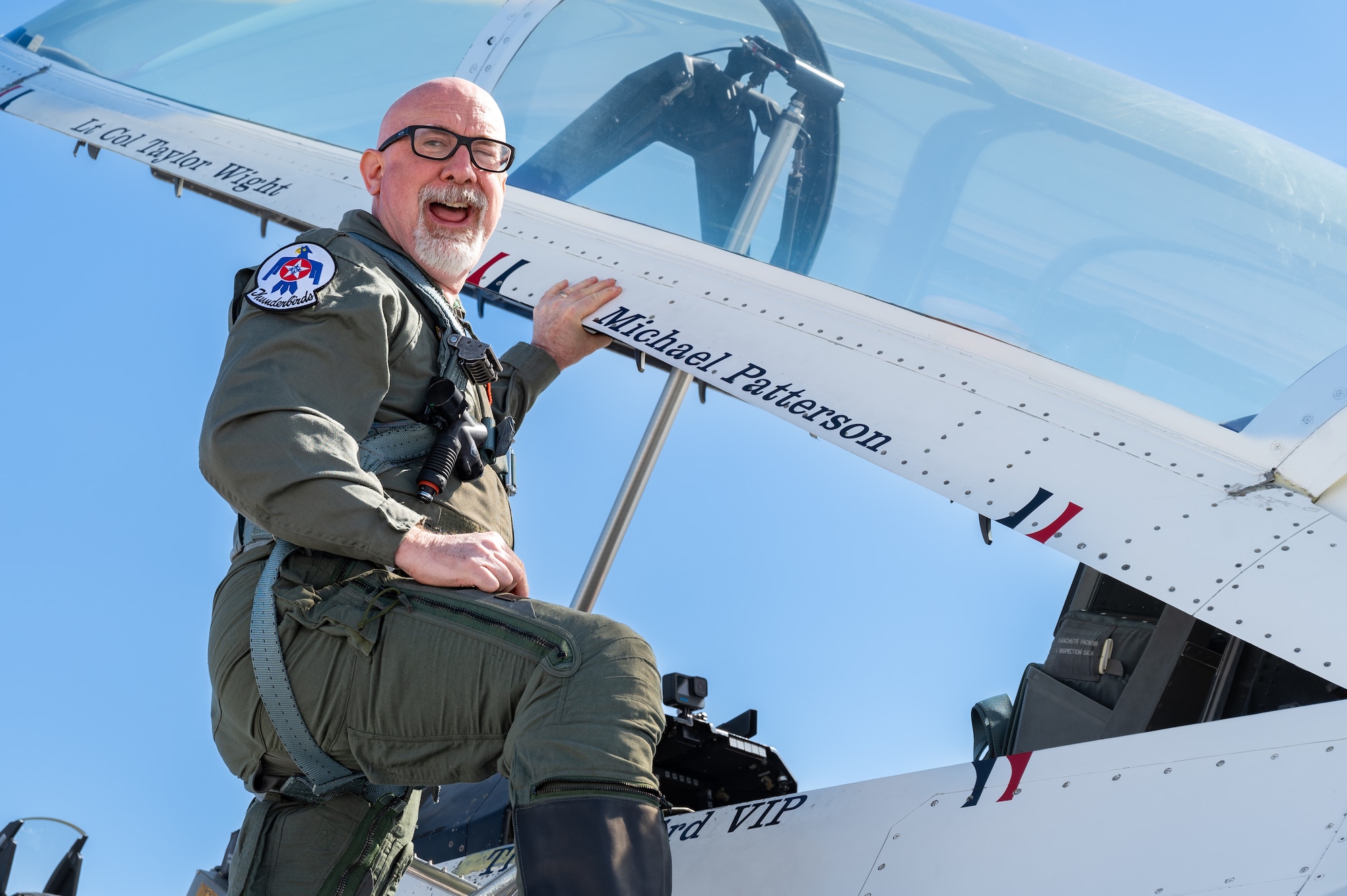 Michael Patterson, Hometown Hero participant, poses for a picture before his flight with the Thunderbirds on April 4, 2025 at Nellis Air Force Base, Nevada.
