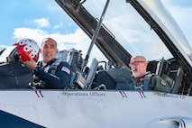 U.S. Air Force Lt. Col. Taylor Wight, left, an operations officer assigned to the Thunderbirds, and Michael Patterson, a Hometown Hero participant, prepare to taxi for flight, on April 4, 2025 at Nellis Air Force Base, Nevada.