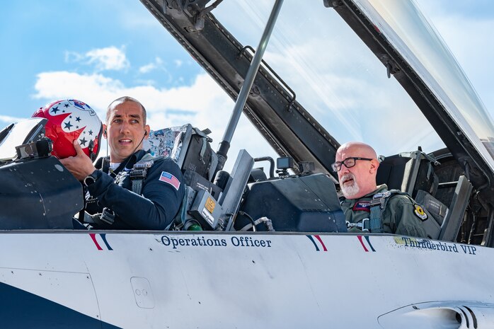 U.S. Air Force Lt. Col. Taylor Wight, left, an operations officer assigned to the Thunderbirds, and Michael Patterson, a Hometown Hero participant, prepare to taxi for flight, on April 4, 2025 at Nellis Air Force Base, Nevada.
