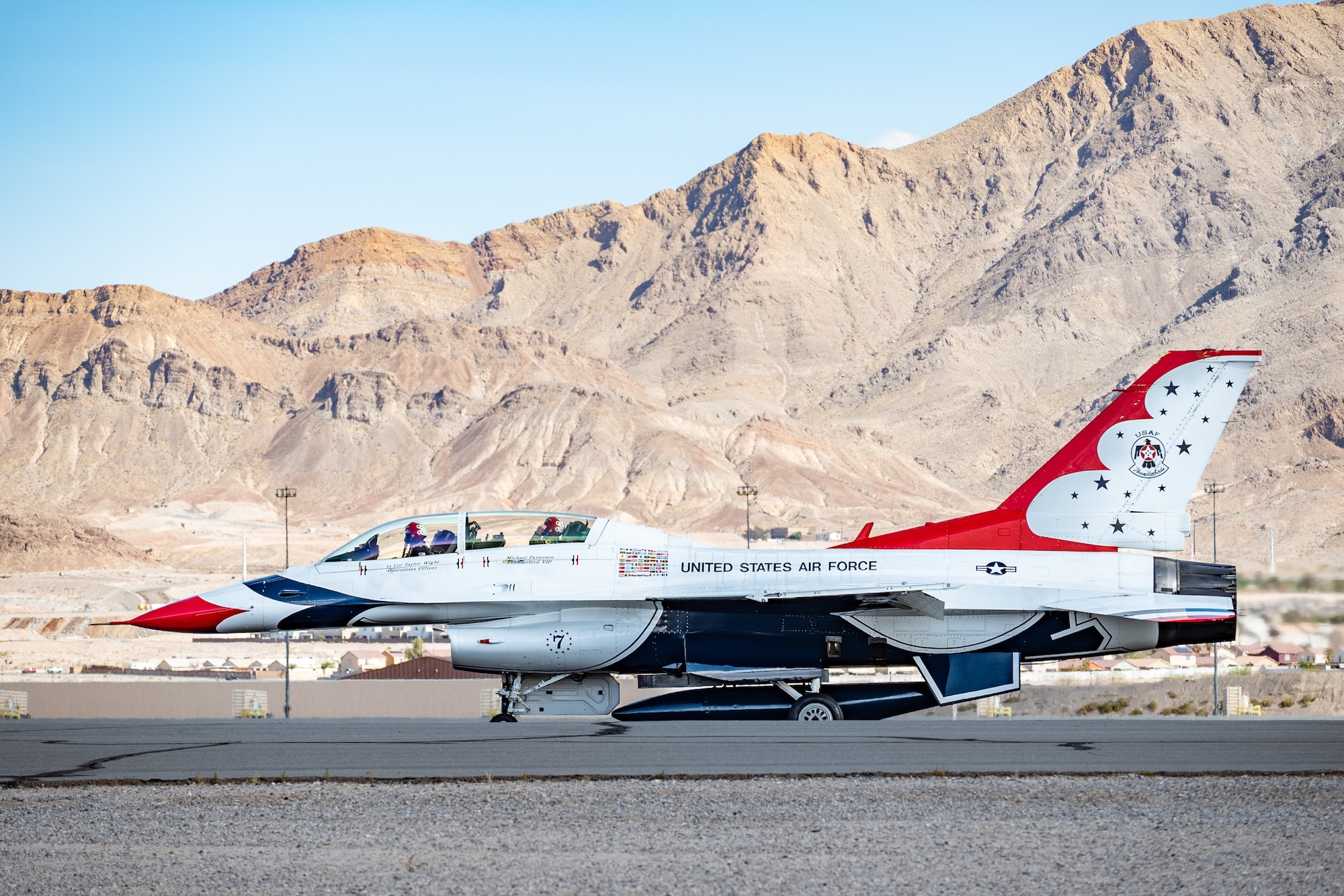 U.S. Air Force Lt. Col. Taylor Wight, left, an operations officer assigned to the Thunderbirds, and Michael Patterson, a Hometown Hero participant, prepare for take-off on April 4, 2025, at Nellis Air Force Base, Nevada.