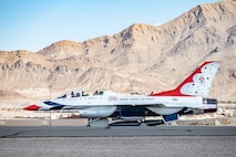 U.S. Air Force Lt. Col. Taylor Wight, left, an operations officer assigned to the Thunderbirds, and Michael Patterson, a Hometown Hero participant, prepare for take-off on April 4, 2025, at Nellis Air Force Base, Nevada.