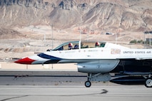 U.S. Air Force Lt. Col. Taylor Wight, an operations officer assigned to the Thunderbirds, and Michael Patterson, a Hometown Hero participant, prepare for take-off on April 4, 2025, at Nellis Air Force Base, Nevada.