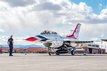 From left to right, U.S. Air Force Staff Sgt. Chase Messner, #8 assistant dedicated crew chief assigned to the Thunderbirds, finalizes a preflight check for the Hometown Hero flight with Lt. Col. Taylor Wight, an operations officer and pilot assigned to the Thunderbirds, and Michael Patterson, a Hometown Hero candidate, on April 4, 2025 at Nellis Air Force Base, Nevada