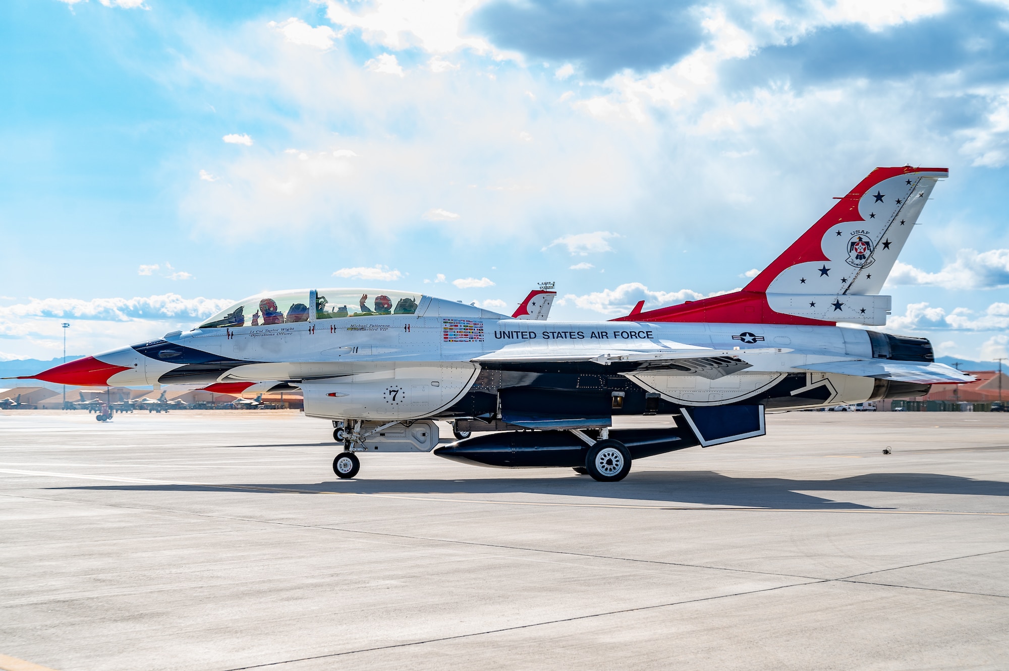 U.S. Air Force Lt. Col. Taylor Wight, left, an operations officer assigned to the Thunderbirds, and Michael Patterson, a Hometown Hero participant, taxi on the runway on April 4, 2025, at Nellis Air Force Base, Nevada