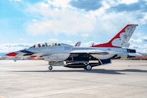 U.S. Air Force Lt. Col. Taylor Wight, left, an operations officer assigned to the Thunderbirds, and Michael Patterson, a Hometown Hero participant, taxi on the runway on April 4, 2025, at Nellis Air Force Base, Nevada