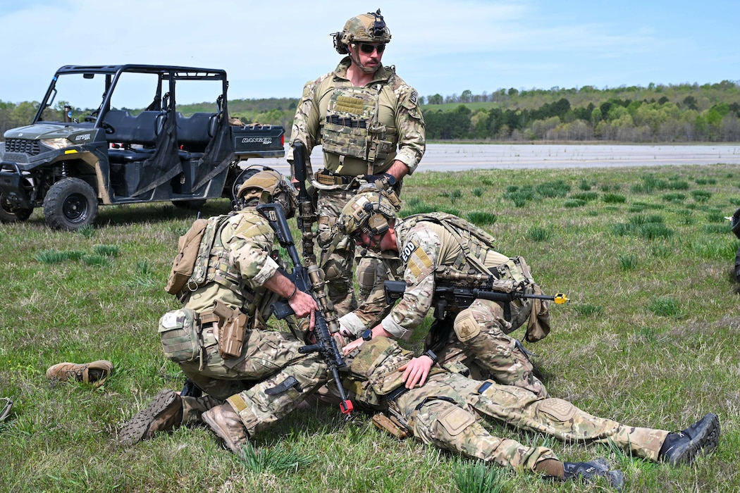 Explosive ordnance disposal (EOD) technicians and 19th Medical Group personnel conduct tactical combat casualty care (TCCC) and medical evacuation procedures during a joint EOD field training exercise at Camp Joseph T. Robinson, Arkansas, April 10, 2025. The exercise not only sharpened the EOD teams’ technical and tactical skills but also strengthened the critical bond between explosive ordnance disposal personnel and their medical counterparts.