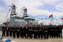 Sailors, officials, dignitaries and guests pose for a group photo following the commissioning of two Tunisian Navy Island Class Patrol Boats transferred from the United States in Tunis, Tunisia, April 17, 2025.