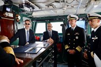 Ambassador Joey Hood, left U.S. Ambassador to the Republic of Tunisia, Khaled Sehili, center left, Tunisian Minister of National Defense, and Vice Adm. J.T. Anderson, center right, commander, U.S. 6th Fleet, have a discussion aboard Blue Ridge-class command and control ship USS Mount Whitney (LCC 20) April 17, 2025.
