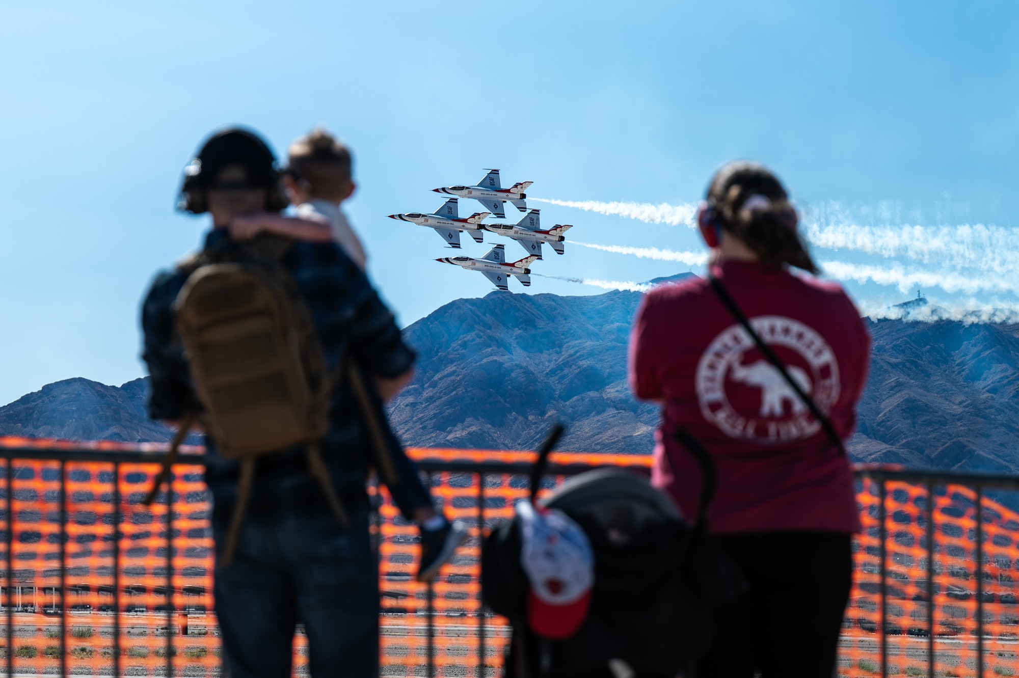 Attendees watch as the U.S. Air Force Thunderbirds perform during Aviation Nation 2025 at Nellis Air Force Base, Nevada, April 4, 2025.