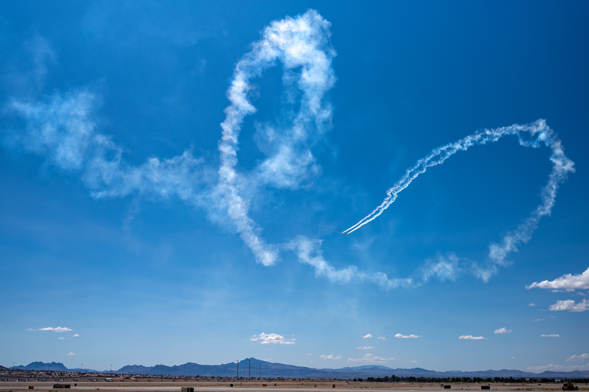 The Undaunted team perform an aerial display with a two ship formation with a Van’s RV-7 and a Van’s RV-8 aircraft during Aviation Nation 2025 at Nellis Air Force Base, Nevada, April 4, 2025.