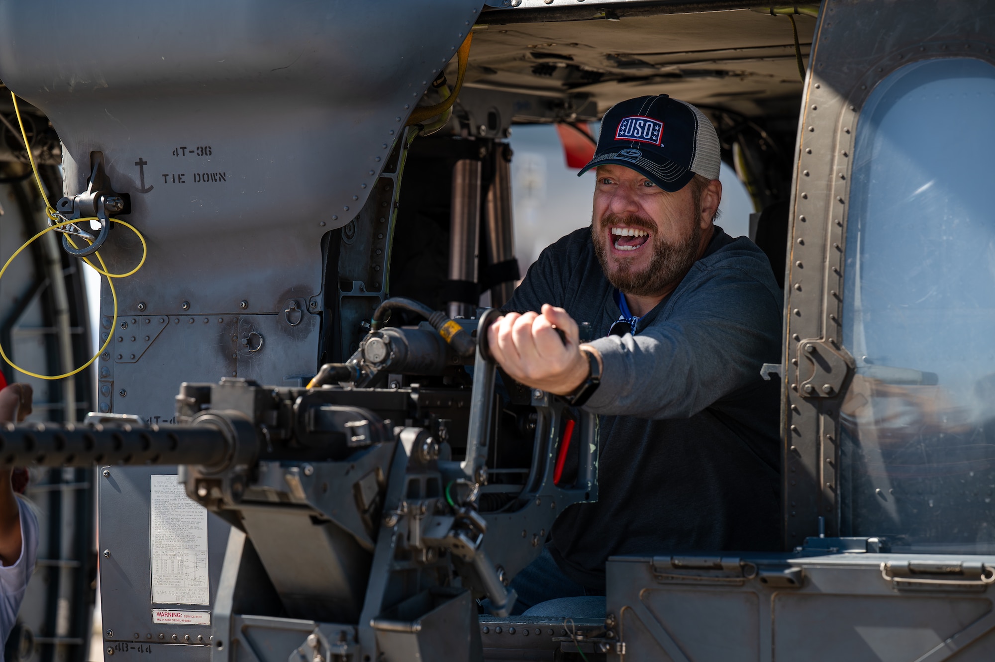 A guest of the Aviation Nation 2025 air show explores inside an HH-60W Jolly Green II helicopter at Nellis Air Force Base, Nevada, April 5, 2025.