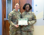 Congratulations to 1st Lt. Helen Aldridge, Tripler Army Medical Center's most recent Daisy Award recipient!

Aldridge, a pediatric nurse, was nominated for the award by the mother of a patient who was diagnosed with cancer. She wrote that "Nurse Helen" showed an incredible amount of compassion to the patient and her family. Col. Rosemary Baugh, TAMC's chief nursing officer, presented the award on April 14.

The nominator wrote the following:

"Due to the nature of my daughter’s treatment, she was often confined to the pediatric unit, which can be difficult for a child to understand. Nurse Helen made it a point to ensure she felt as comfortable as possible during her stay. She would often remind my daughter about the different toys she could use to ride around the halls, offering small but meaningful distractions.

As time passed, my daughter struggled to cope with the prolonged hospital stay. It was heartbreaking to witness her withdraw, not understanding why we were still there or how long we would remain. I knew this was a normal reaction for a child in her situation, but it didn’t make it any easier to watch.

What stood out most was that Nurse Helen never gave up on her. She continued to encourage my daughter to leave her room and engage with her surroundings.

Nurse Helen’s unwavering compassion and dedication is something we will never forget. Her kindness made a lasting impact on my daughter, who will always remember her as someone who brightened an incredibly difficult time."