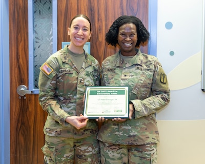Congratulations to 1st Lt. Helen Aldridge, Tripler Army Medical Center's most recent Daisy Award recipient!

Aldridge, a pediatric nurse, was nominated for the award by the mother of a patient who was diagnosed with cancer. She wrote that "Nurse Helen" showed an incredible amount of compassion to the patient and her family. Col. Rosemary Baugh, TAMC's chief nursing officer, presented the award on April 14.

The nominator wrote the following:

"Due to the nature of my daughter’s treatment, she was often confined to the pediatric unit, which can be difficult for a child to understand. Nurse Helen made it a point to ensure she felt as comfortable as possible during her stay. She would often remind my daughter about the different toys she could use to ride around the halls, offering small but meaningful distractions.

As time passed, my daughter struggled to cope with the prolonged hospital stay. It was heartbreaking to witness her withdraw, not understanding why we were still there or how long we would remain. I knew this was a normal reaction for a child in her situation, but it didn’t make it any easier to watch.

What stood out most was that Nurse Helen never gave up on her. She continued to encourage my daughter to leave her room and engage with her surroundings.

Nurse Helen’s unwavering compassion and dedication is something we will never forget. Her kindness made a lasting impact on my daughter, who will always remember her as someone who brightened an incredibly difficult time."