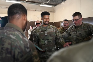 U.S. Air Force Staff Sgt. Hector Medina Jr., 8th Maintenance Squadron Munitions Flight combat plans supervisor, instructs 8th MXS Munitions Flight Airmen on combat munitions training.
