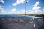 The aircraft carrier USS Nimitz (CVN 68) pulls into Naval Base Guam for a scheduled port visit, April 18, 2025.
