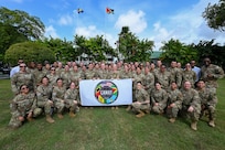 U.S. Air Force Maj. Gen. Melissa A. Coburn, 22nd Air Force commander, U.S. Air Force Lt. Col. Angella Mudd, 433rd Aeromedical Staging Squadron and LAMAT Guyana mission commander, and U.S. Air Force LAMAT members pose for a group photo following the closing ceremony for the LAMAT mission at the Guyana President’s estate in Georgetown, Guyana, April 11, 2025.