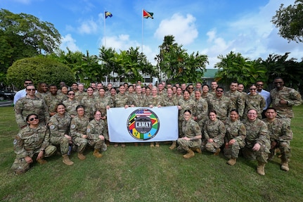 U.S. Air Force Maj. Gen. Melissa A. Coburn, 22nd Air Force commander, U.S. Air Force Lt. Col. Angella Mudd, 433rd Aeromedical Staging Squadron and LAMAT Guyana mission commander, and U.S. Air Force LAMAT members pose for a group photo following the closing ceremony for the LAMAT mission at the Guyana President’s estate in Georgetown, Guyana, April 11, 2025.