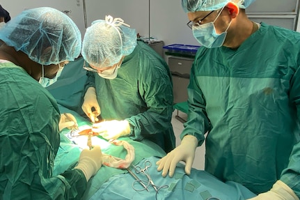 U.S. Air Force Lt. Col. Jermey Bolin, 959th Medical Group vascular surgeon, left, Tameshwar Algu, New Amsterdam Hospital general surgeon, center-left, U.S. Air Force Maj. Porter Maerz, 96th Surgical Operations Squadron general surgeon, center-right, and U.S. Air Force Capt. Randy Perez, 301st Medical Squadron operating room nurse, right, performs a vascular procedure on a patient at the New Amsterdam Public Hospital in New Amsterdam, Guyana, April 1, 2025.