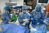 U.S. Air Force Maj. Samuel Hobbs, 59th Medical Wing vitreoretinal surgeon, works with local healthcare professionals during ophthalmology surgery at the Georgetown Public Hospital, Georgetown, Guyana, April 7, 2025 during the Lesser Antilles Medical Assistance Team 2025 mission.