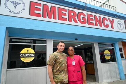 U.S. Air Force Tech. Sgt. Rodrigo Salinas, 433rd Aeromedical Staging Squadron medical technician, and Gangapattie Dani, Georgetown Public Hospital Accident and Emergency Department ward manager, pose for a photos outside the emergency room at the Georgetown Public Hospital during the Lesser Antilles Medical Assistance Team mission in Georgetown, Guyana, April 7, 2025.