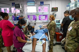 U.S. Air Force members from the 433rd Aeromedical Staging Squadron work with Guyanese healthcare professionals during an emergency at the Georgetown Public Hospital during the Lesser Antilles Medical Assistance Team mission in Georgetown, Guyana, April 3, 2025.