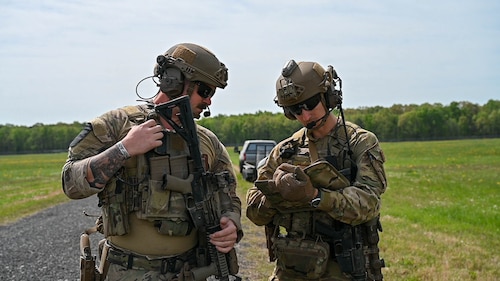 Explosive ordnance disposal (EOD) technicians and 19th Medical Group personnel take notes during a joint EOD field training exercise at Camp Joseph T. Robinson, Arkansas, April 10, 2025. The week-long training emphasized interoperability between EOD technicians and medics, with scenarios that mimicked injuries sustained during combat missions.