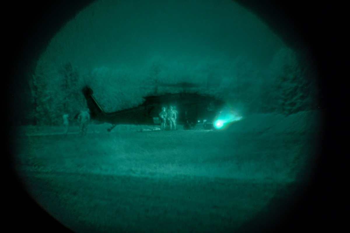 Explosive ordnance disposal (EOD) technicians and 19th Medical Group personnel transport a simulated casualty during a joint EOD field training exercise at Camp Joseph T. Robinson, Arkansas, April 9, 2025. The week-long training emphasized interoperability between EOD technicians and medics, with scenarios that mimicked injuries sustained during combat missions.