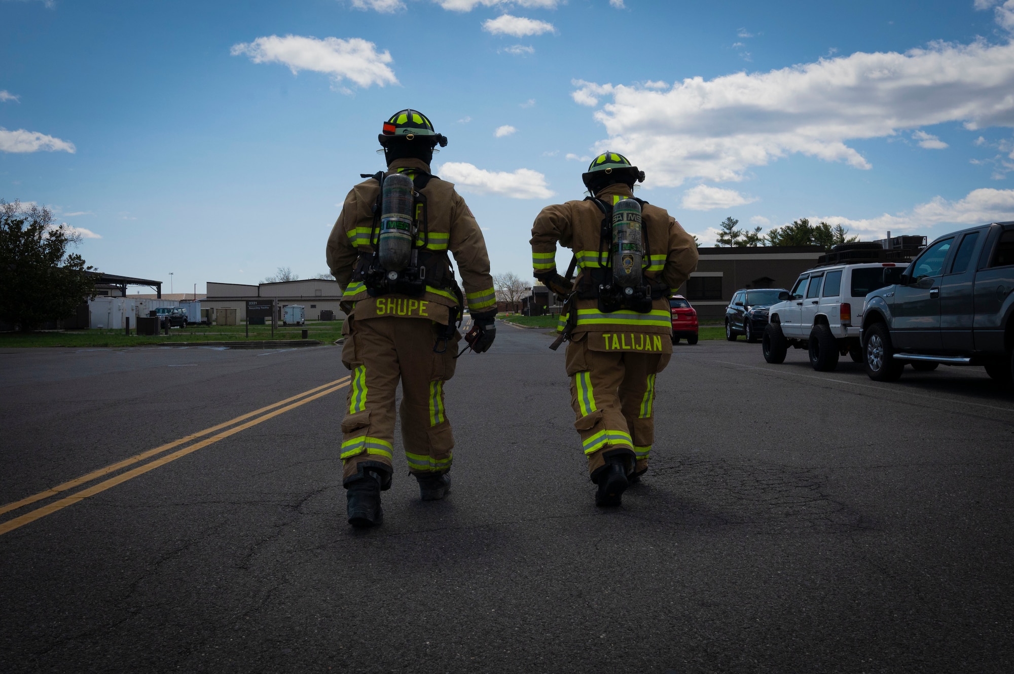 U.S. Air Force Staff Sgt. William Shupe and Senior Airman Joshua Talijan 87th Civil Engineer Squadron firefighters, respond to a simulated fire during Operation Honey Badger (OHB) at Joint Base McGuire-Dix-Lakehurst, N.J., April 8, 2025. OHB is an exercise organized by the 87th Civil Engineer Squadron to prepare Airmen for real-world situations and promote mission readiness. (U.S. Air Force photo by Airman 1st Class Luisa E. Dugan)