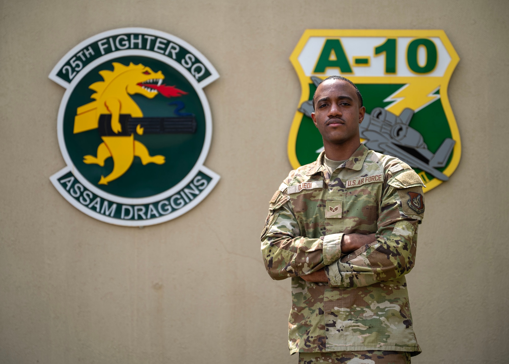 U.S. Air Force Senior Airman Christopher Djedi, 25th Fighter Squadron commander’s support staff, poses for a photo at Osan Air Base, Republic of Korea, April 16, 2025. Djedi was recognized as Mustang of the Week for his professional commitment in the workplace. (U.S. Air Force photo by Senior Airman Sarah Williams)