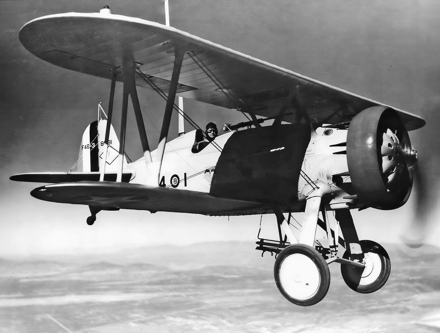 An F4B-3 of Marine Bombing Squadron (VB) 4M in 1933. It has a bomb rack below the fuselage, and, in place of a tailhook, it carries a radio antenna mast behind the cockpit.