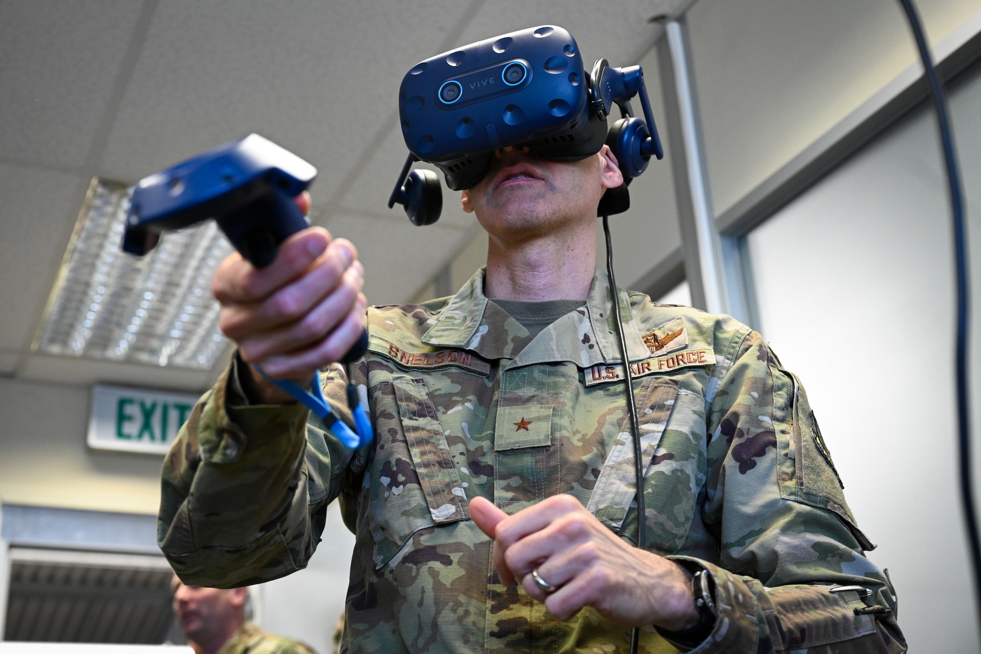 Brig. Gen. Stephen Snelson, U.S. Air Force Expeditionary Center commander, uses a Virtual Reality headset during an immersion tour with the 726th Air Mobility Squadron at the 726 AMS headquarters building on Spangdahlem Air Base, Germany, April 10, 2025.