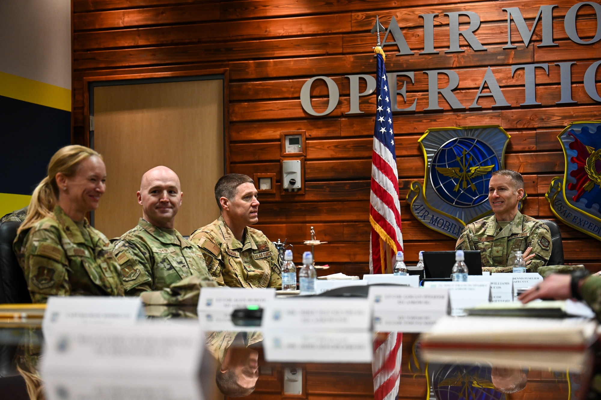 Brig. Gen. Stephen Snelson, right, U.S. Air Force Expeditionary Center commander, prepares to receive a brief from 521st Air Mobility Operations Wing leadership during an immersion tour at the 521 AMOW headquarters building on Ramstein Air Base, Germany, April 10, 2025.