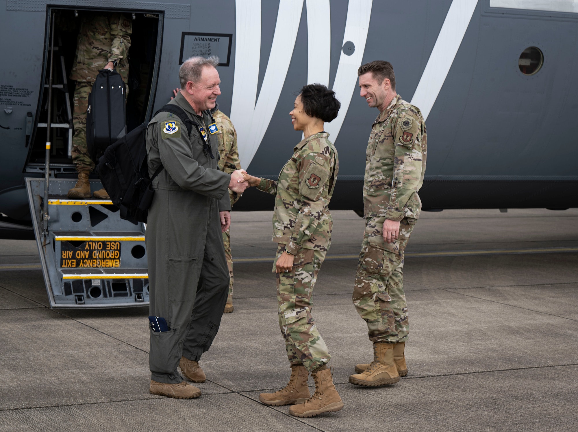 U.S. Air Force Gen. James Hecker, left, U.S. Air Forces in Europe - Air Forces Africa commander, greets the 100th Air Refueling Wing leadership team after arriving at RAF Mildenhall, England, April 14, 2025.