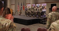 Soldiers from the Louisiana National Guard’s 256th Infantry Brigade Combat Team are honored during a deployment ceremony at the Cajundome Convention Center in Lafayette, Louisiana, April 13, 2025.