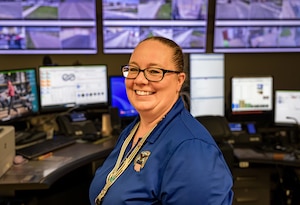 Defense Logistics Agency Emergency Service Supervisor pose for a photo at her desk