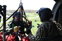 U.S. Army 1st Sgt. Steven Lucas, a UH-60 Black Hawk helicopter standardization instructor with the Maryland National Guard performs rescue hoist operations.