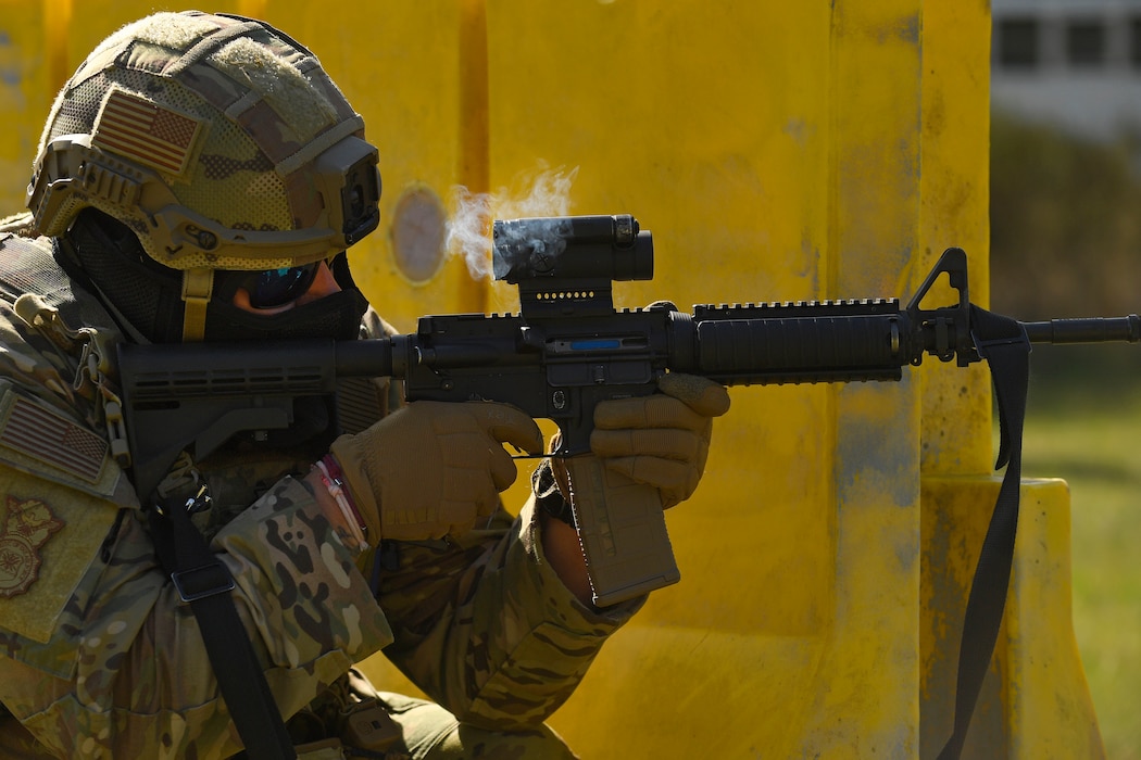 Airman firing a gun