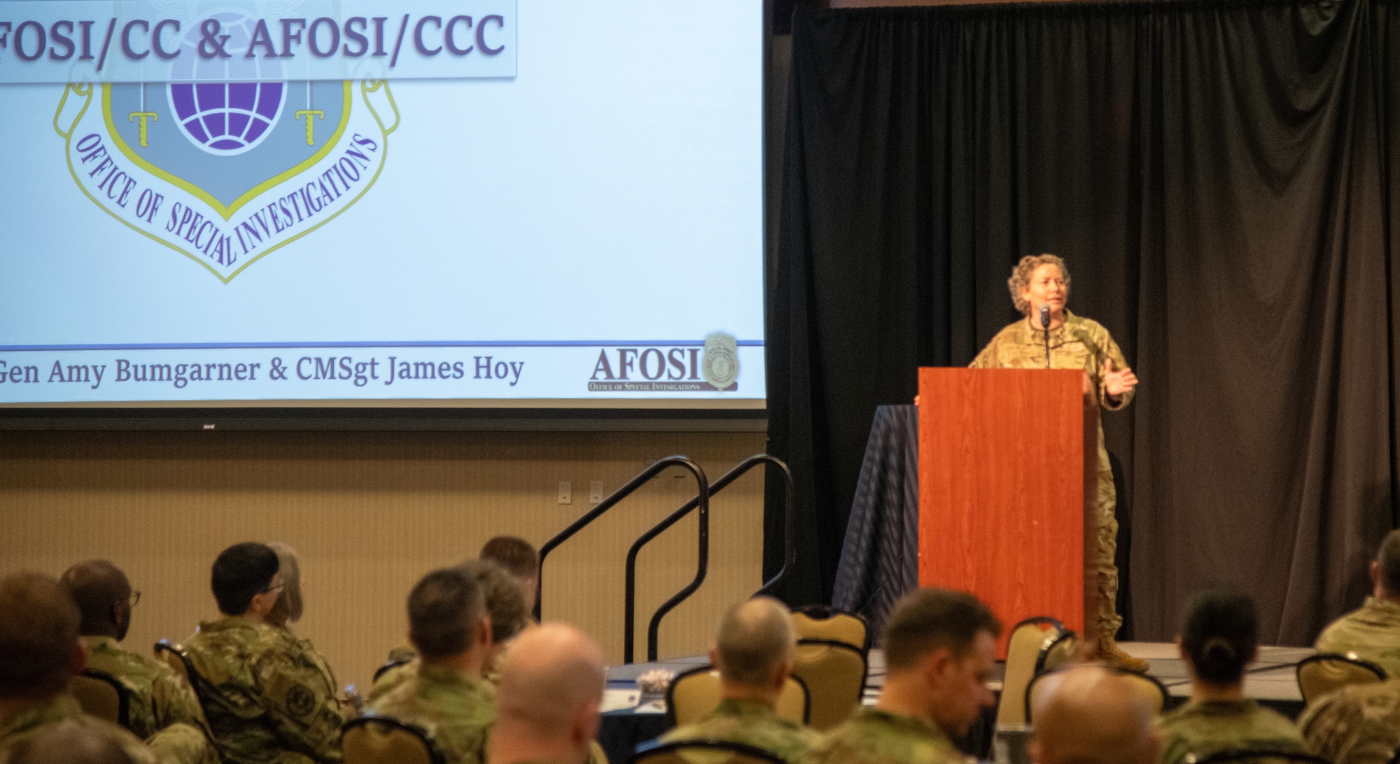 Brig. Gen. Amy Bumgarner, Air Force Office of Special Investigations commander, addresses AFOSI’s Reserve Individual Mobility Augmentees during the Combined Training Assembly at the National Conference Center in Leesburg, Virginia, April 12, 2025. Bumgarner emphasized the value added by the broad range of expertise brought to the AFOSI mission by its IMA force, made of part-time Reservists largely with outside careers in law enforcement. (U.S. Air Force photo by Capt. Justin Clark)
