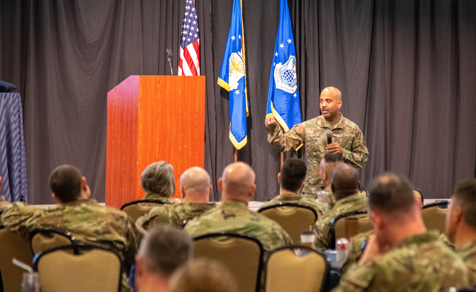Chief Master Sgt. Israel Nuñez, Senior Enlisted Advisor to the Chief of Air Force Reserve, speaks to Reservists at the Air Force Office of Special Investigations Combined Training Assembly in Leesburg, Virginia, April 12, 2025. Nuñez addressed the group of nearly 300 attendees, highlighting the Reserve enlisted force’s role in bridging operational gaps and supporting the Air Force’s total-force future needs. (U.S. Air Force photo by Capt. Justin Clark)