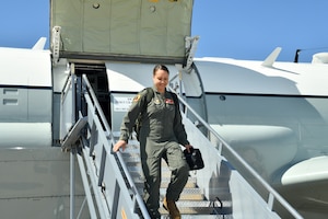 woman descending airplane steps