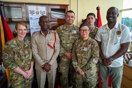 Gregory Wickham, Guyana Fire Services chief fire officer, and Ron Morris, Guyana Emergency Medical Service chief emergency medical technician, pose for a photo with U.S. Air Force members from the 433rd Aeromedical Staging Squadron at the Guyana Fire Station Headquarters on a tour during the LAMAT mission in Georgetown, Guyana, April 2, 2025.