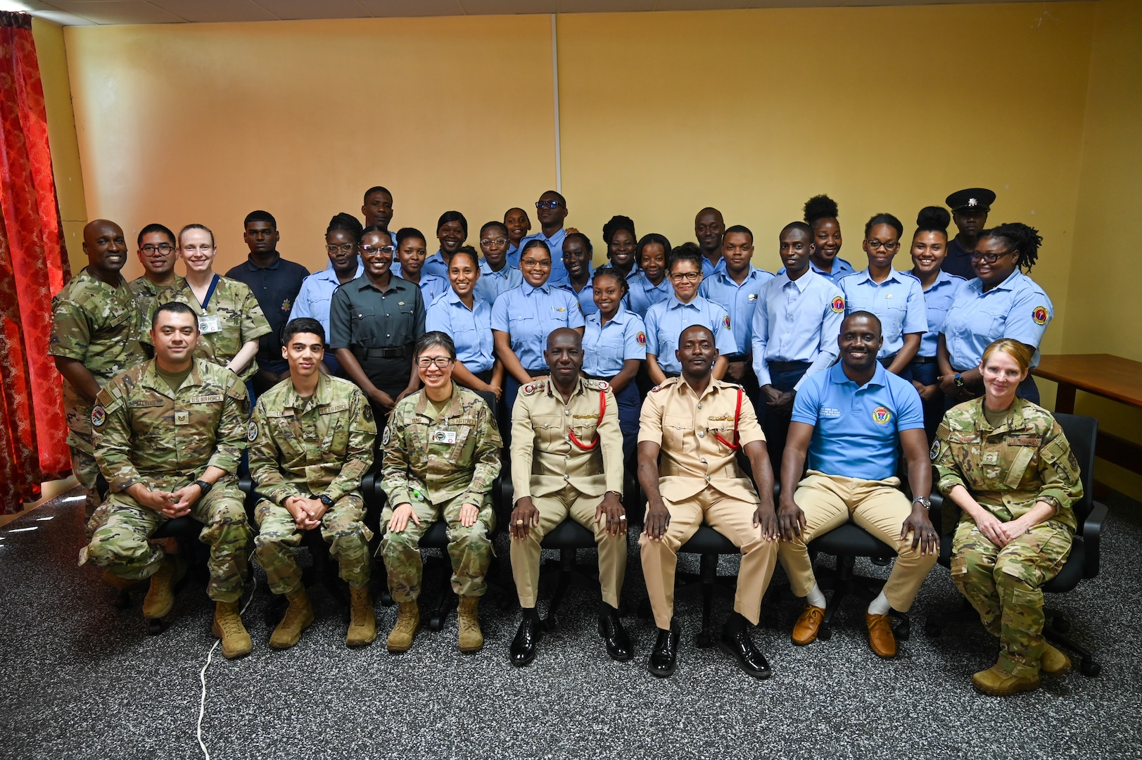 Gregory Wickham, chief fire officer of the Guyana Fire Service; Cleon Thom-Fernandes, assistant divisional officer, GFS; and Ron Morris, chief emergency medical technician of the Guyana Emergency Medical Service, pose for a group photo after completing tactical combat casualty care training at the Guyana Fire Service Headquarters in Georgetown, Guyana, April 9, 2025.