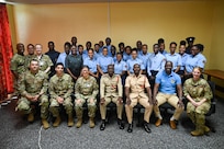 Gregory Wickham, chief fire officer of the Guyana Fire Service; Cleon Thom-Fernandes, assistant divisional officer, GFS; and Ron Morris, chief emergency medical technician of the Guyana Emergency Medical Service, pose for a group photo after completing tactical combat casualty care training at the Guyana Fire Service Headquarters in Georgetown, Guyana, April 9, 2025.