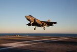 An F-35C Lightning II, assigned to Marine Fighter Attack Squadron (VMFA) 314, arrives aboard USS Abraham Lincoln (CVN 72).