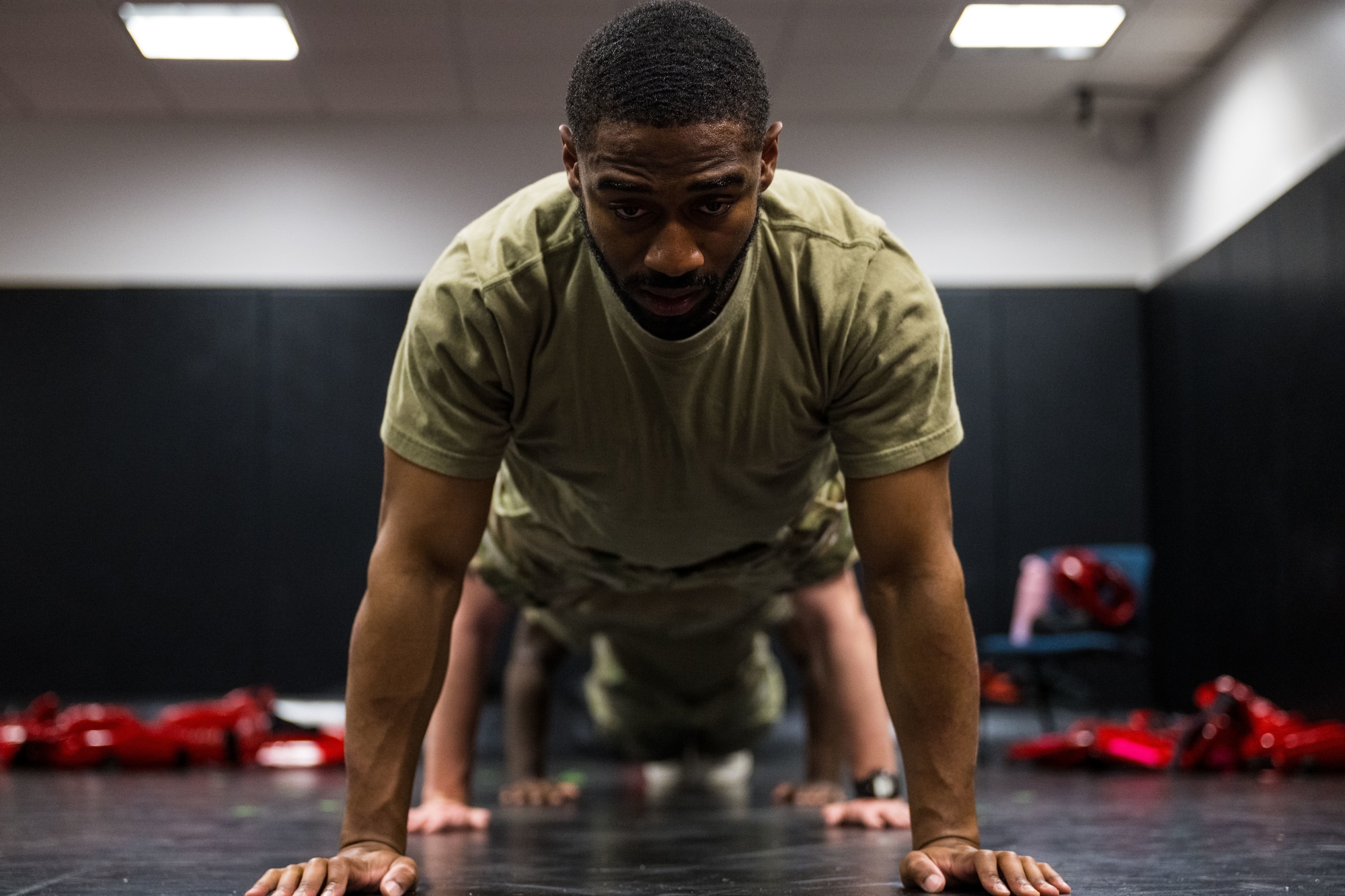Phoenix Raven candidates participate in warm up exercises prior to Red Man exercises.