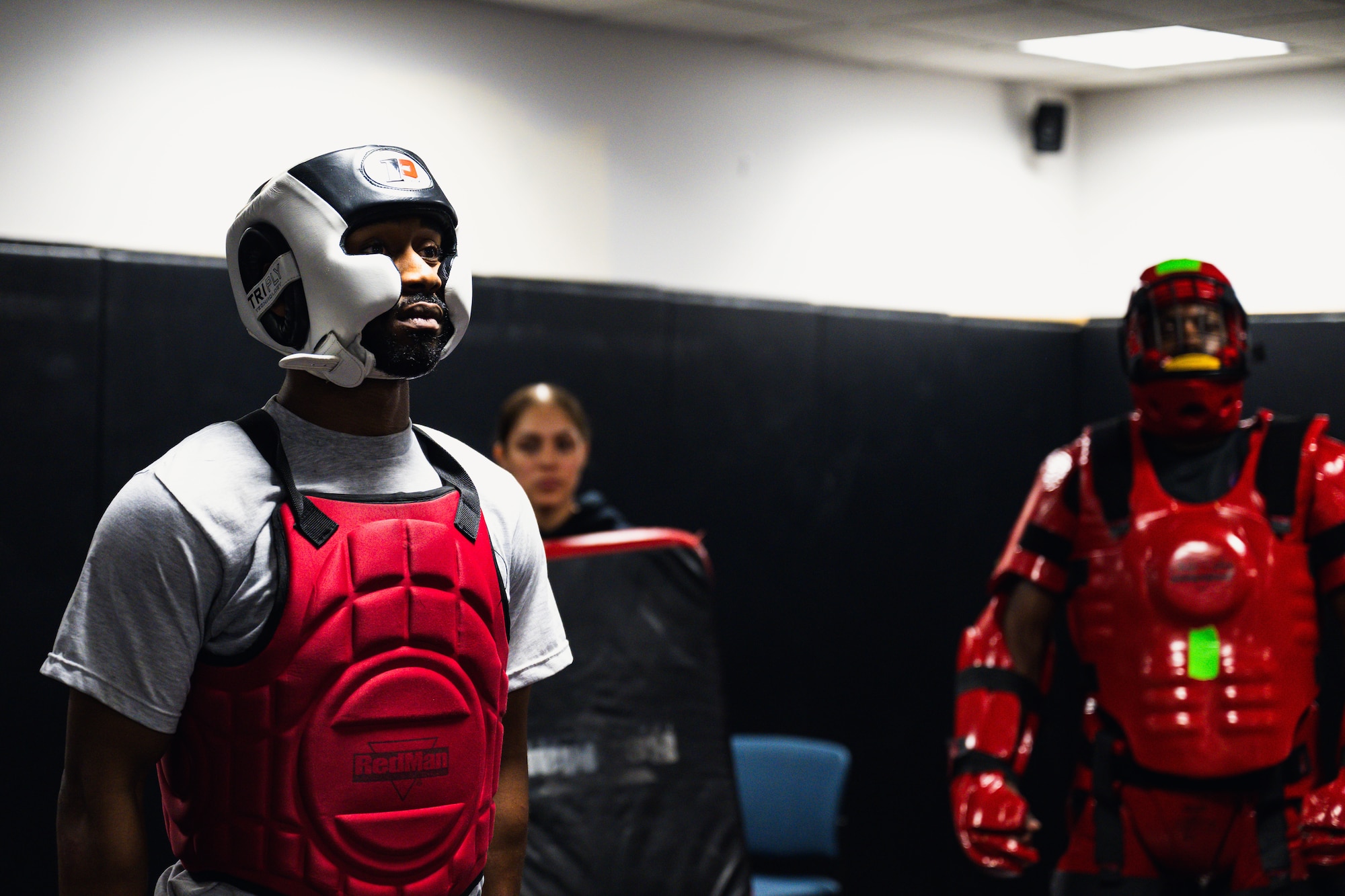 A Phoenix Raven candidate listens to feedback he received during a Red Man training exercise.